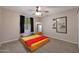 Bedroom with a yellow bedspread and ceiling fan at 3502 E Janice Way, Phoenix, AZ 85032