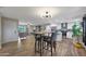 Remodeled kitchen with island, stainless steel appliances, and white shaker cabinets at 3502 E Janice Way, Phoenix, AZ 85032