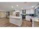 Modern kitchen featuring a large island, stainless steel appliances, and white cabinetry at 3502 E Janice Way, Phoenix, AZ 85032