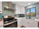 Modern kitchen features stainless steel appliances and white cabinets at 3502 E Janice Way, Phoenix, AZ 85032