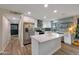 Updated kitchen with white cabinets, stainless steel appliances, and an island at 3502 E Janice Way, Phoenix, AZ 85032