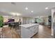Open concept kitchen with island and stainless steel appliances at 3502 E Janice Way, Phoenix, AZ 85032