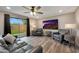 Living room with leather furniture and sliding doors to patio at 3502 E Janice Way, Phoenix, AZ 85032