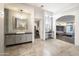 Spa-like bathroom with double vanity, walk-in shower, and large mirror at 5311 N Palo Cristi Rd, Paradise Valley, AZ 85253