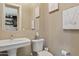 Stylish powder room with pedestal sink and modern fixtures at 5420 E Duane Ln, Cave Creek, AZ 85331