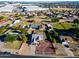 Aerial view of a house with a large yard and surrounding suburban neighborhood at 5701 N 105Th Ln, Glendale, AZ 85307