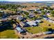 Aerial view of a property with multiple structures and a sizable lot at 5701 N 105Th Ln, Glendale, AZ 85307