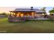 Covered patio and large backyard with a built-in BBQ area at 5701 N 105Th Ln, Glendale, AZ 85307