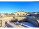 Landscaped backyard with fire pit and seating area at 5701 N 105Th Ln, Glendale, AZ 85307