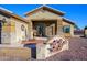 A charming ranch-style home with a welcoming porch and attractive landscaping at 5701 N 105Th Ln, Glendale, AZ 85307