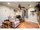 Relaxing Gathering room featuring comfy seating and hardwood floors at 5701 N 105Th Ln, Glendale, AZ 85307