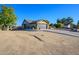 Single story home with attached garage and a long driveway at 5701 N 105Th Ln, Glendale, AZ 85307