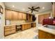 Bright laundry room with built-in cabinets and a large countertop at 5701 N 105Th Ln, Glendale, AZ 85307