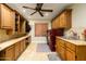 Laundry room with built-in cabinets, countertop, and a washer and dryer at 5701 N 105Th Ln, Glendale, AZ 85307