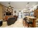 Open living area with a stone fireplace and built-in entertainment center at 5701 N 105Th Ln, Glendale, AZ 85307