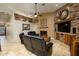 Open living room with a stone fireplace and built-in entertainment center at 5701 N 105Th Ln, Glendale, AZ 85307