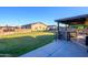 Outdoor kitchen with a stone bar and built-in appliances at 5701 N 105Th Ln, Glendale, AZ 85307