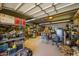Organized workshop with various tools and storage shelving at 5701 N 105Th Ln, Glendale, AZ 85307