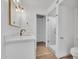 Bright bathroom with white vanity, gold fixtures, and a glass shower at 6480 N 82Nd St # 1138, Scottsdale, AZ 85250