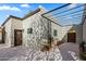 Modern backyard patio with pergola and gate, offering a private outdoor space at 6715 E Beryl Ave, Paradise Valley, AZ 85253