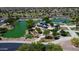 Aerial view of community with lake, playground, and green areas at 7369 W Cactus Wren Way, Florence, AZ 85132