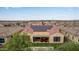 Aerial view of home with solar panels and backyard patio at 7369 W Cactus Wren Way, Florence, AZ 85132