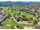 Aerial view showcasing homes and golf course views at 7710 E Gainey Ranch Rd # 157, Scottsdale, AZ 85258