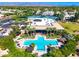 Aerial view of community pool, tennis courts, and surrounding landscape at 7710 E Gainey Ranch Rd # 157, Scottsdale, AZ 85258