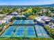 Aerial view of community tennis courts and surrounding landscape at 7710 E Gainey Ranch Rd # 157, Scottsdale, AZ 85258