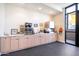 Community coffee bar with beverage machines and seating area at 7710 E Gainey Ranch Rd # 157, Scottsdale, AZ 85258