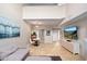 Open living area with sectional sofa, dining area, and TV at 7710 E Gainey Ranch Rd # 157, Scottsdale, AZ 85258