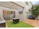 Outdoor patio with pergola, fire pit, and grill at 7710 E Gainey Ranch Rd # 157, Scottsdale, AZ 85258