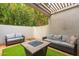 Private patio with seating area and artificial turf at 7710 E Gainey Ranch Rd # 157, Scottsdale, AZ 85258