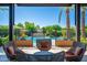 Relaxing patio furniture overlooking a sparkling community pool at 7710 E Gainey Ranch Rd # 157, Scottsdale, AZ 85258