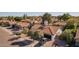 Elevated perspective of a single-Gathering home with a tile roof and attached garage, seen from across the street at 937 E Knight Ln, Tempe, AZ 85284