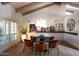 Elegant dining area with a dark wood table and modern chairs, complemented by artwork at 12697 N 84Th Pl, Scottsdale, AZ 85260