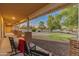 Relaxing front porch with rocking chairs overlooking the landscaped yard at 1409 E Dove Pl, Casa Grande, AZ 85122