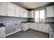 Laundry room with plenty of cabinet space at 1907 W Brooke Ln, Queen Creek, AZ 85144