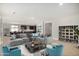 Bright and airy living room with sectional sofa and built-in shelving at 1907 W Brooke Ln, Queen Creek, AZ 85144