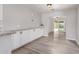 Spacious dining area with white cabinets and hardwood floors at 1941 W Topeka Dr, Phoenix, AZ 85027