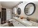 Clean bathroom with double vanity and shower/tub combo at 1964 W Sawtooth Way, San Tan Valley, AZ 85144