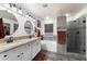 Elegant bathroom with double vanity, soaking tub, and walk-in shower at 1964 W Sawtooth Way, San Tan Valley, AZ 85144