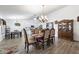 Elegant dining room with a large table and hardwood floors at 1964 W Sawtooth Way, San Tan Valley, AZ 85144