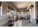 Cozy sunroom with tiled floor and access to the backyard at 1964 W Sawtooth Way, San Tan Valley, AZ 85144