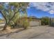 Detached garage with a single door, nestled in a desert landscape setting at 37801 N Cave Creek Rd # 5, Cave Creek, AZ 85331