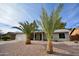 Charming single-story home with palm trees and gravel landscaping at 4441 E Coconino St, Phoenix, AZ 85044