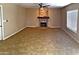 Spacious living room with tile floors and a stone fireplace at 4441 E Coconino St, Phoenix, AZ 85044