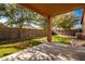 Inviting backyard with grassy lawn and covered patio at 45759 W Morning View Ln, Maricopa, AZ 85139