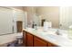 Clean bathroom with double sinks and a shower/tub combo at 45759 W Morning View Ln, Maricopa, AZ 85139