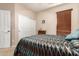Charming bedroom with a unique bedspread and built-in closet at 45759 W Morning View Ln, Maricopa, AZ 85139